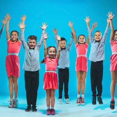 The kids dance school, ballet, hiphop, street, funky and modern dancers on blue studio background